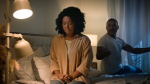 Couple quarrel sad African American woman feel desperate jealous husband angry man shouting accusing