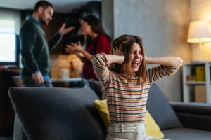 A neglected, frustrated teenager while her parents struggle with relationship problems and argue