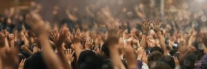 Christian worship with praise to God Ready to raise your hand at the Christian music concert